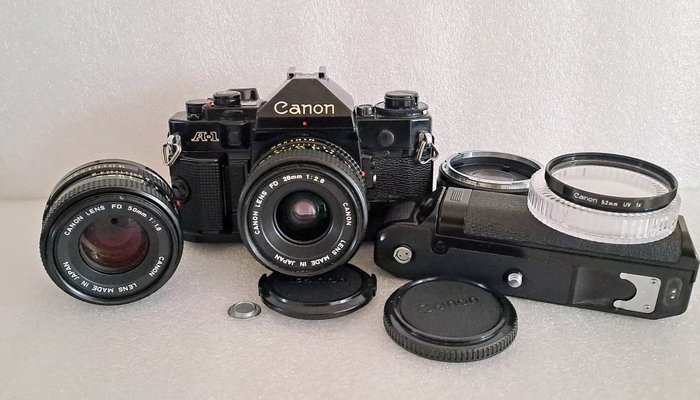 Canon A1 + Canon 28mm 1:2.8 + Canon 50mm 1:1.8 + Canon Power Winder A + accessoires Analogt kamera