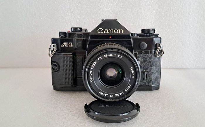 Canon A1 + Canon 28mm 1:2.8 + Canon 50mm 1:1.8 + Canon Power Winder A + accessoires Analogt kamera