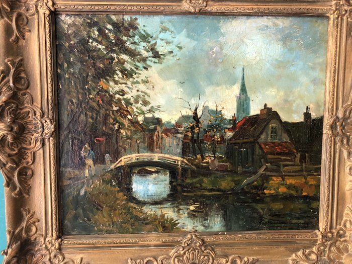 Hollandse School(XX) Martin van Waning (1889-1972), Circle of - Stadsgezicht met brug en figuren