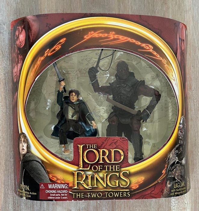 Lord of the Rings The Two Towers - Dual Figure set - Pippin Ugluk - with weapons accessoires and slashing action - ToyBiz