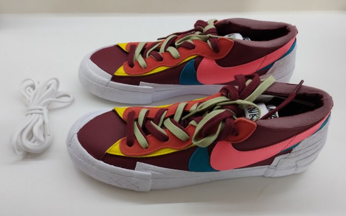 Kaws (1974) - Nike Blazer Low Sacai KAWS Team Red