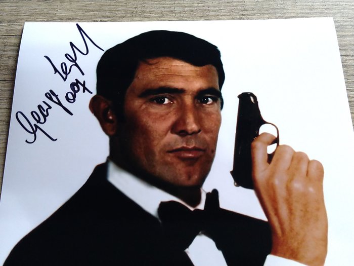 James Bond 007: On Her Majesty’s Secret Service - George Lazenby in classic Bond pose - Signed photo with COA