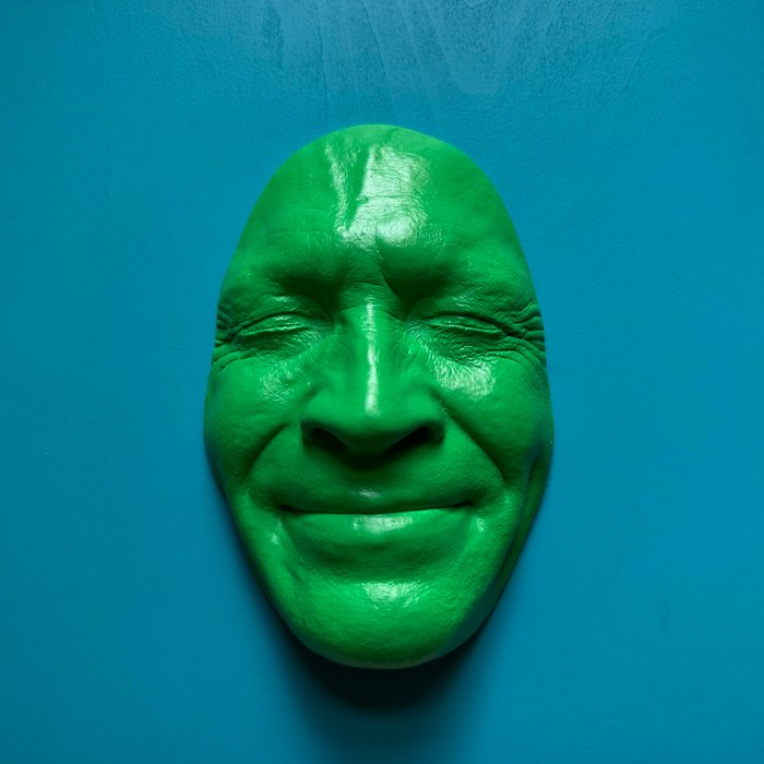 Gregos (1972) - Green light smile on blue light background