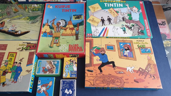 Tintin - 12 Various merchandise objects - Moulinsart, Nathan, Ravensburger, Hemma, Wildhorse, Dusserre, Cartamundi. - 1981