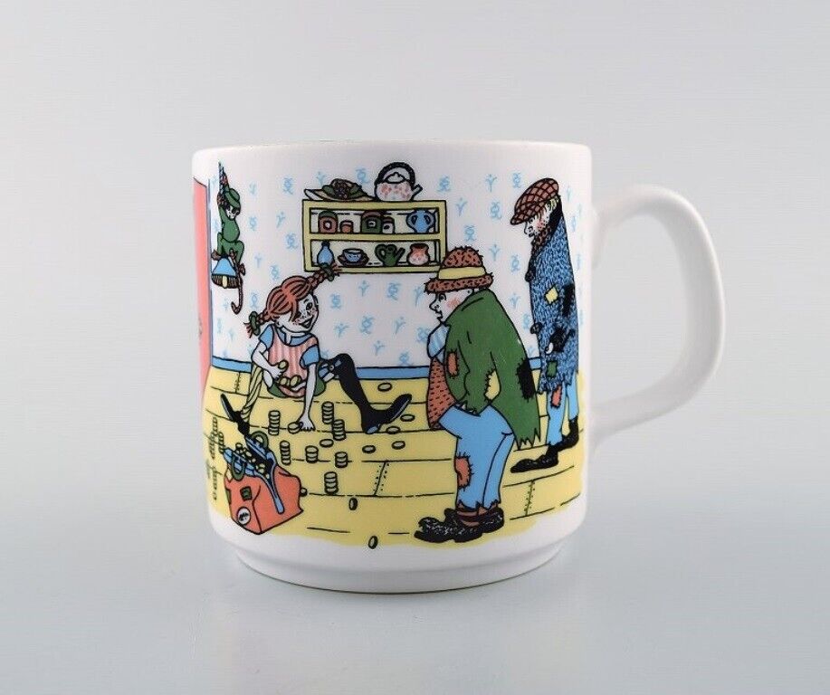 Rörstrand Four cups and a plate in porcelain with Pippi Longstocking motifs