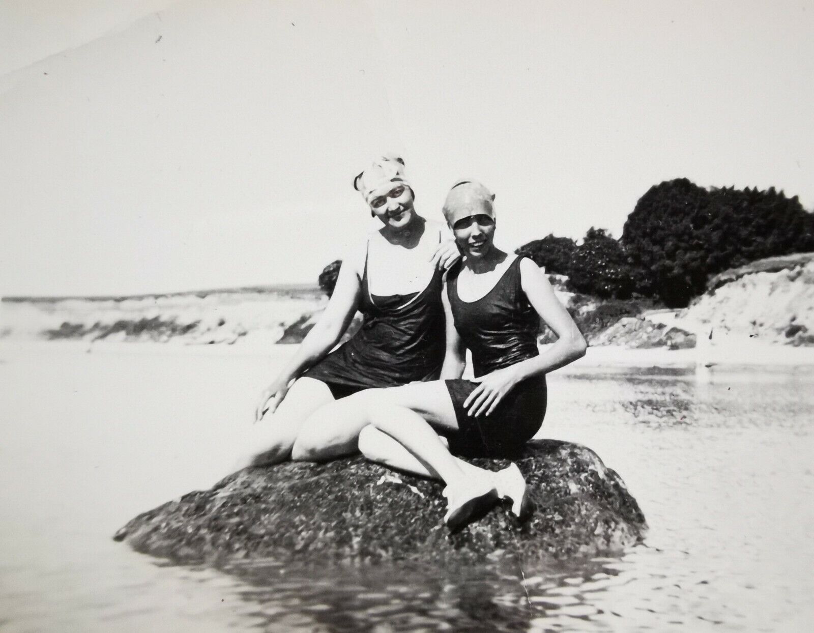 Old photo: Woman and young girl sitting on a big rock in the water c1930 Fo350