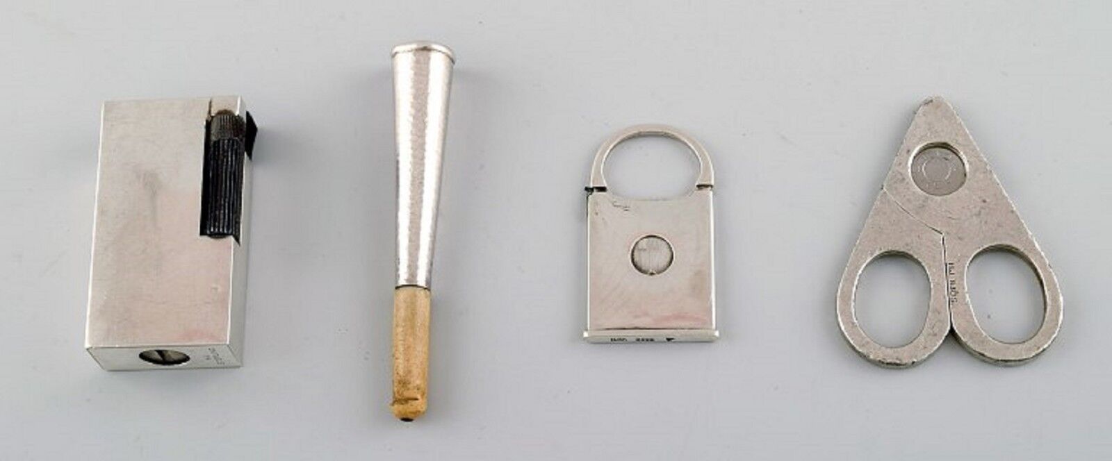 Four pieces Danish silver Lighter cigarette holder and two cigar clippers