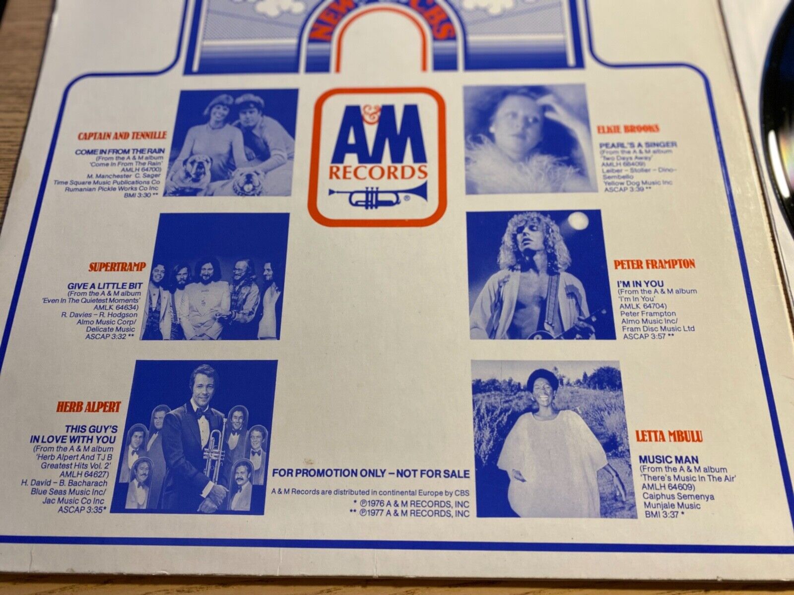 A  M SAMPLER PROMOTIONAL 1977 A  M RECORDS 12" 12 SONGS W GERMAN PRESS PROMO*