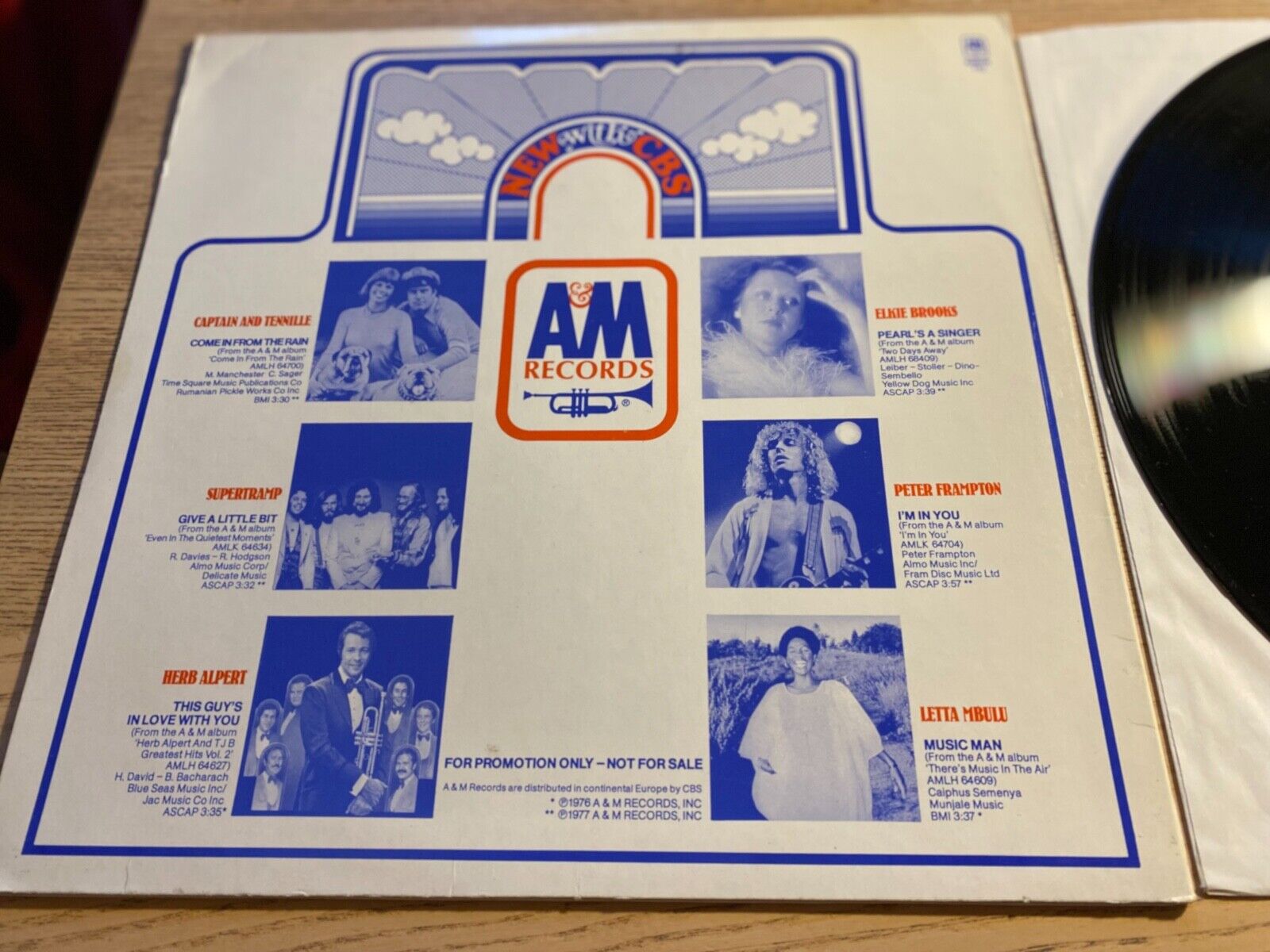 A  M SAMPLER PROMOTIONAL 1977 A  M RECORDS 12" 12 SONGS W GERMAN PRESS PROMO*