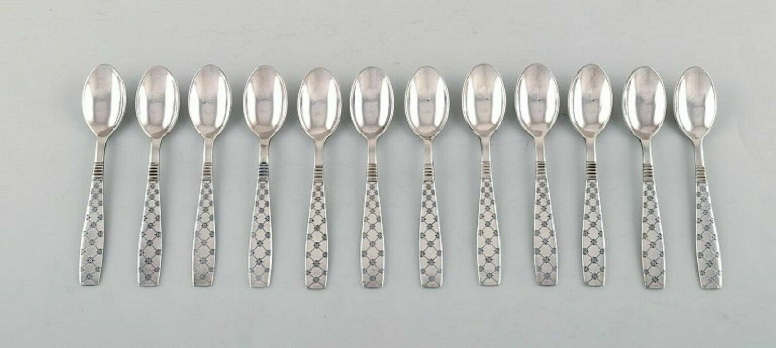 Jens H Quistgaard (1919-2008) Denmark 12 Star teaspoons in plated silver