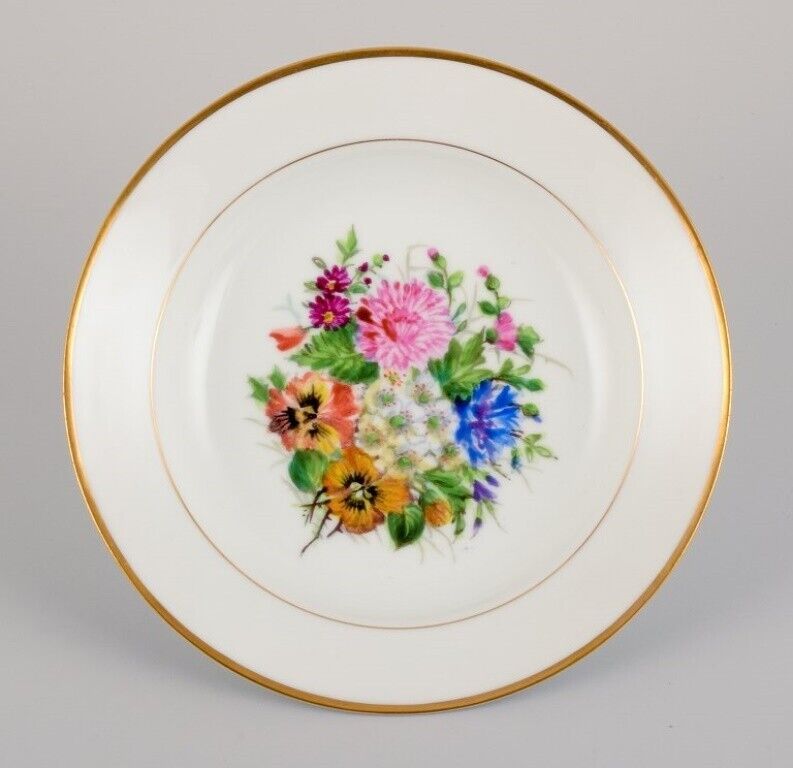 Bing  Grøndahl four deep plates in porcelain with flowers and gold decoration