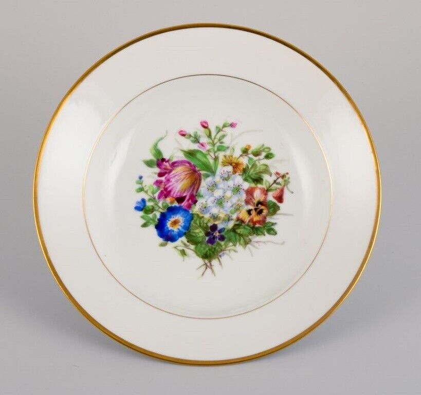 Bing  Grøndahl eight deep plates in porcelain with flowers and gold decoration