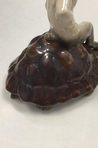 Royal Copenhagen Figurine of faun sitting on a turtle No 1880