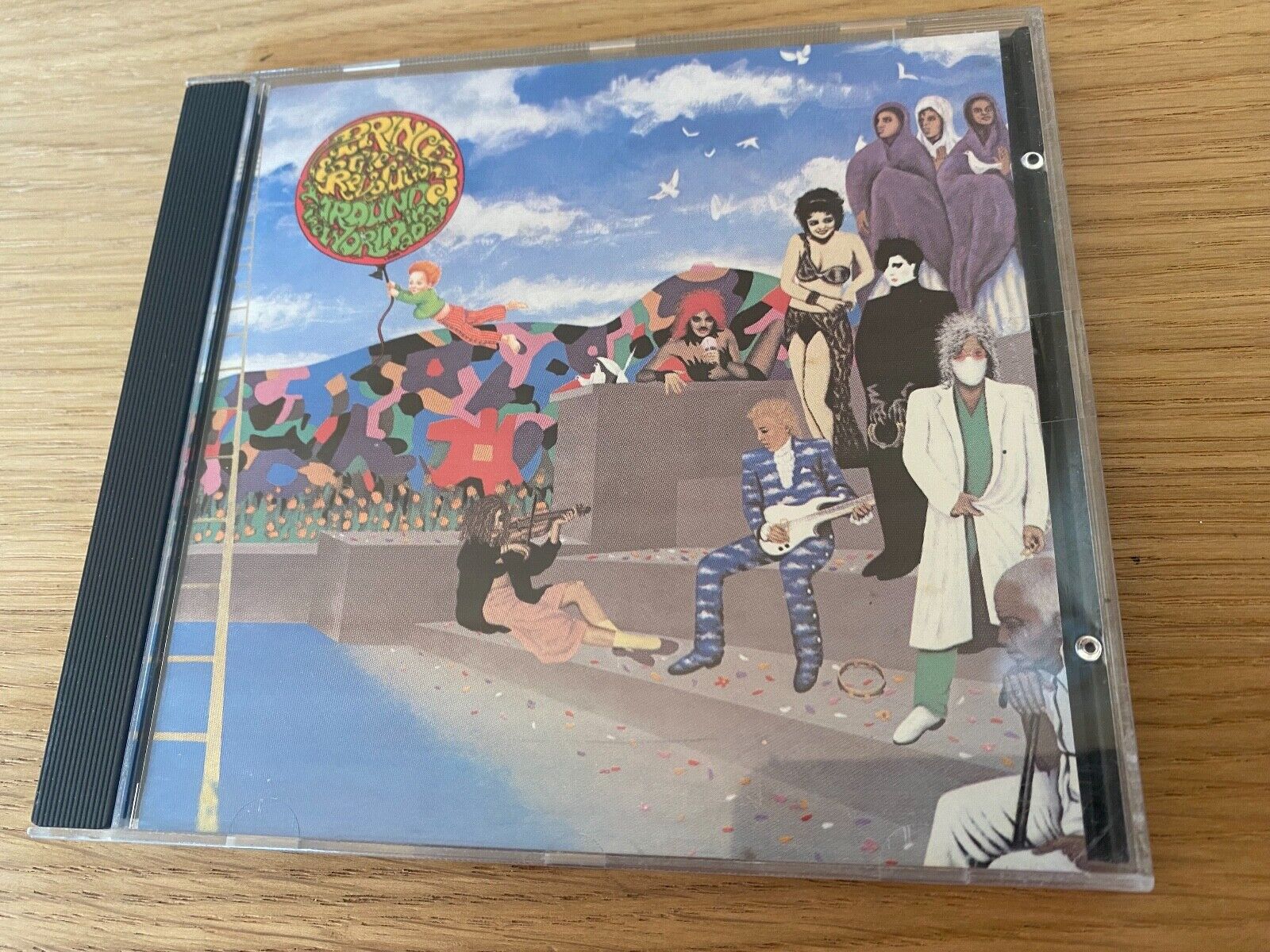 PRINCE  THE REVOLUTION "AROUND THE WORLD IN A DAY" CD ALBUM 9 TRACK WARNER BROS