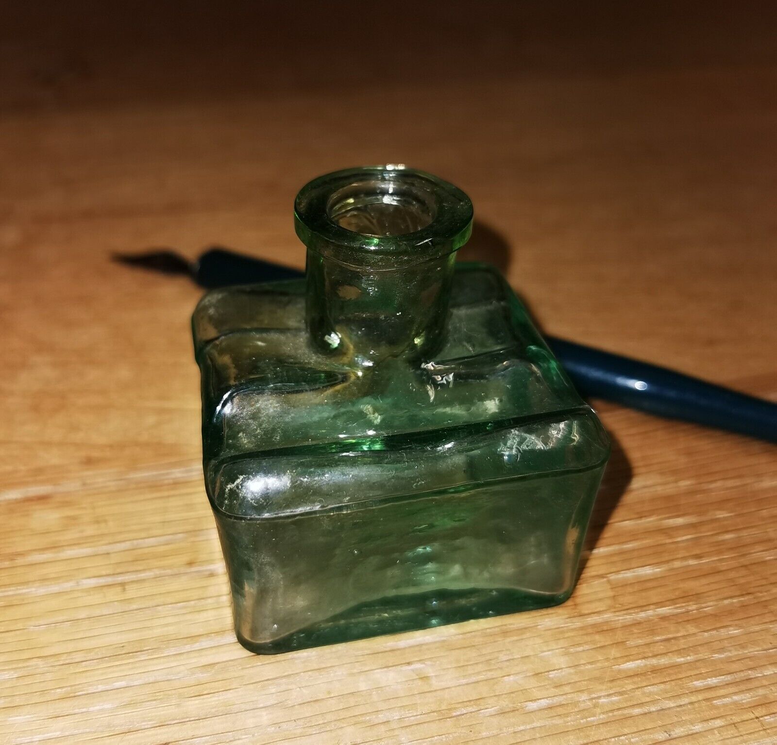 Antique green transparent ink well in glass from the late 19th century