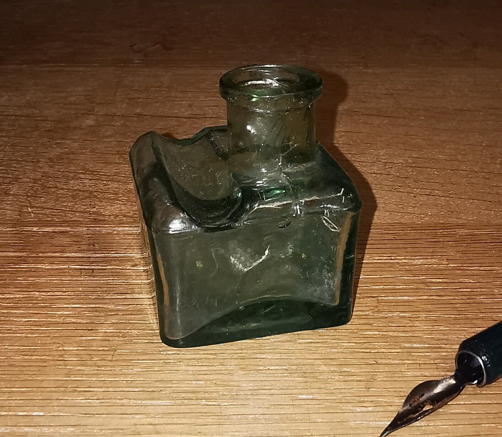 Antique green transparent ink well in glass from the late 19th century