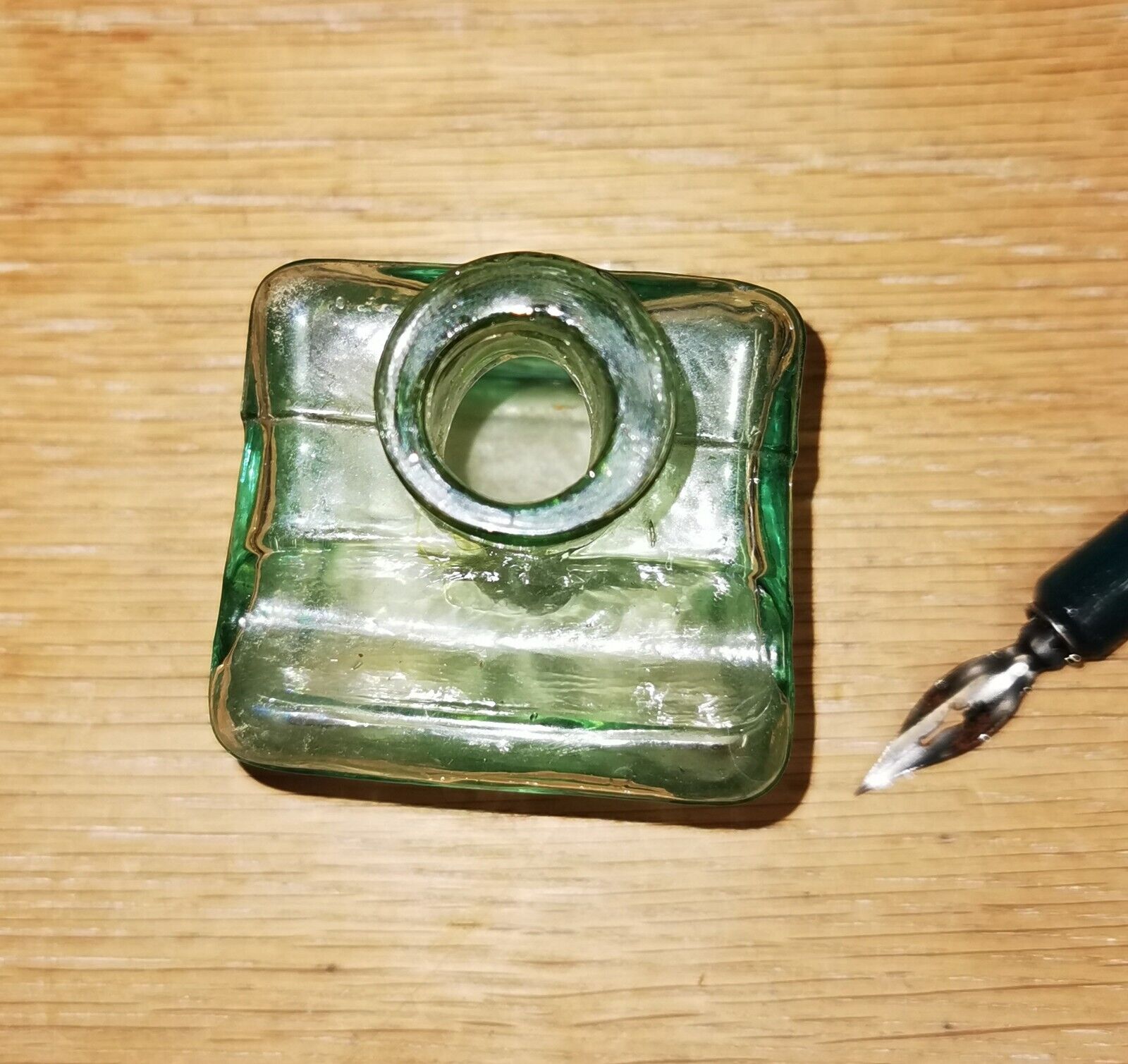 Antique green transparent ink well in glass from the late 19th century