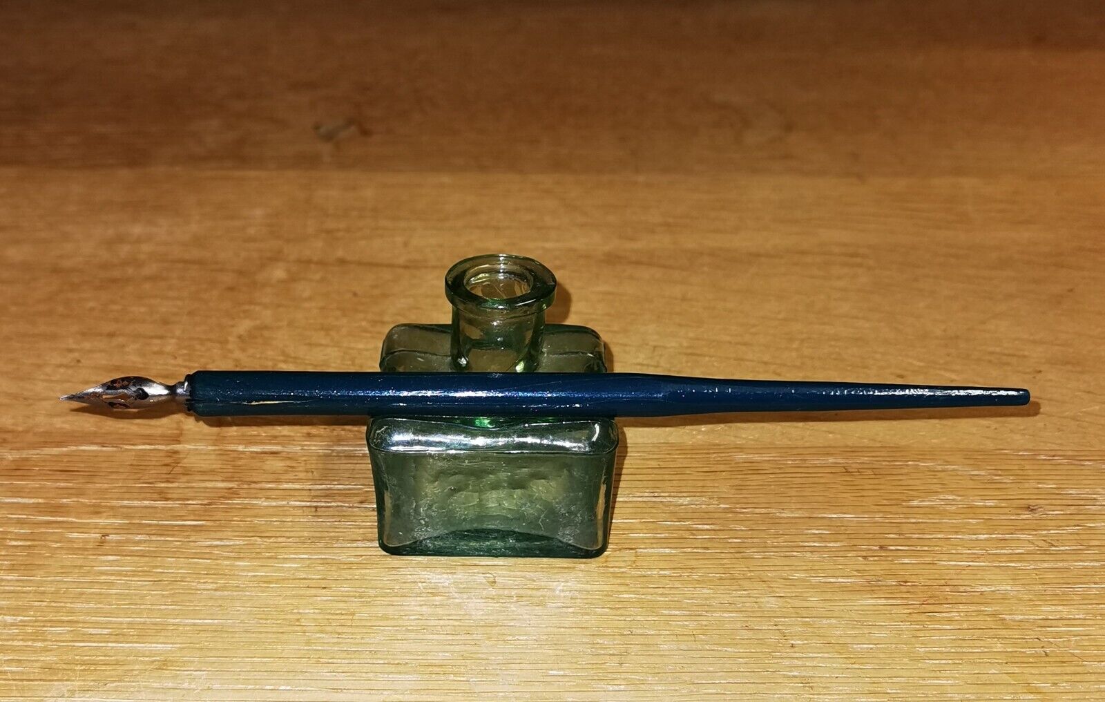 Antique green transparent ink well in glass from the late 19th century