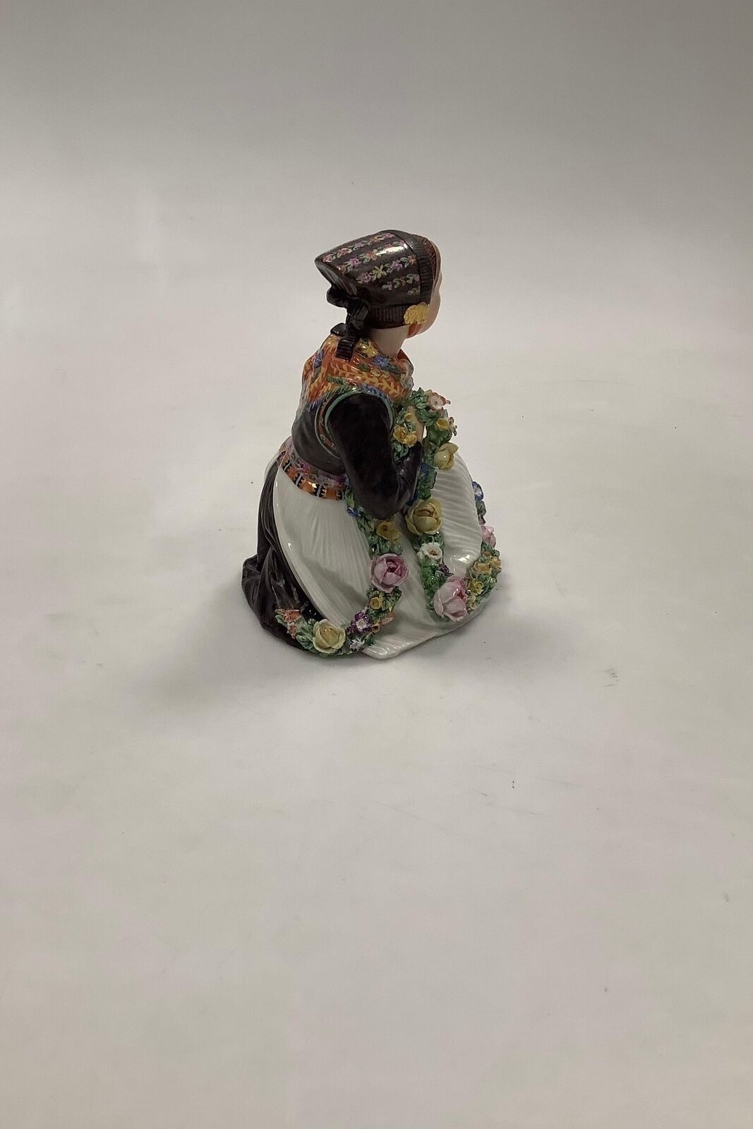 Royal Copenhagen Overglaze figurine of Amager Flower Girl No 12412