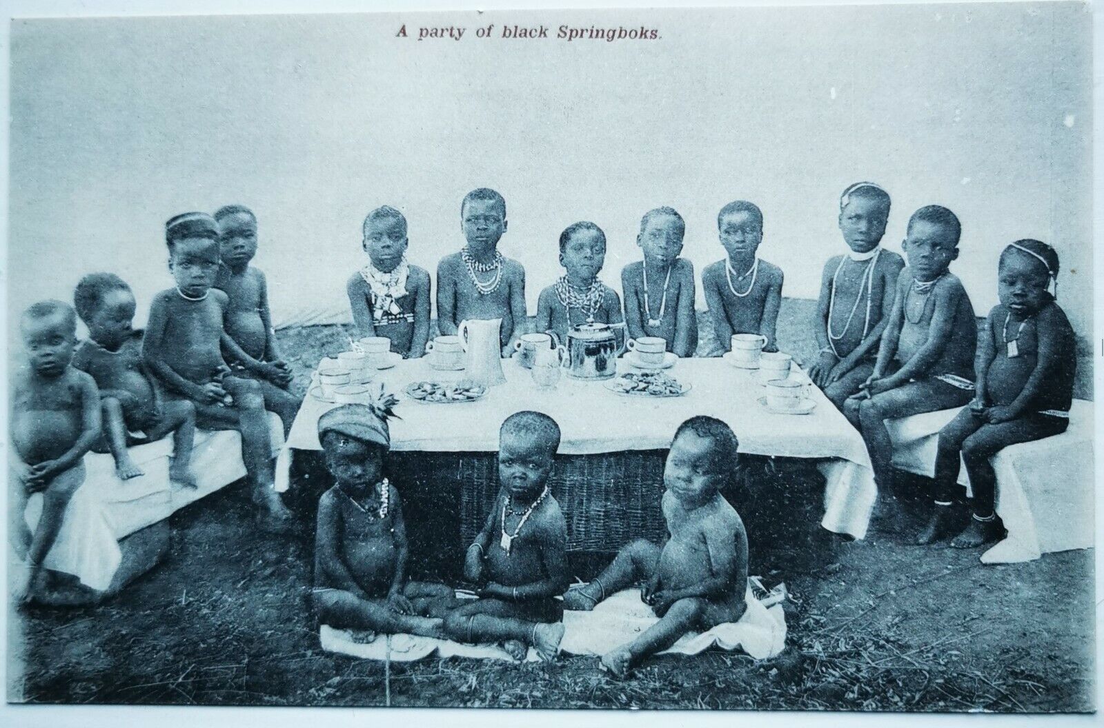 Old Postcard: Black children lined up for at tea party in South Africa  pok1111