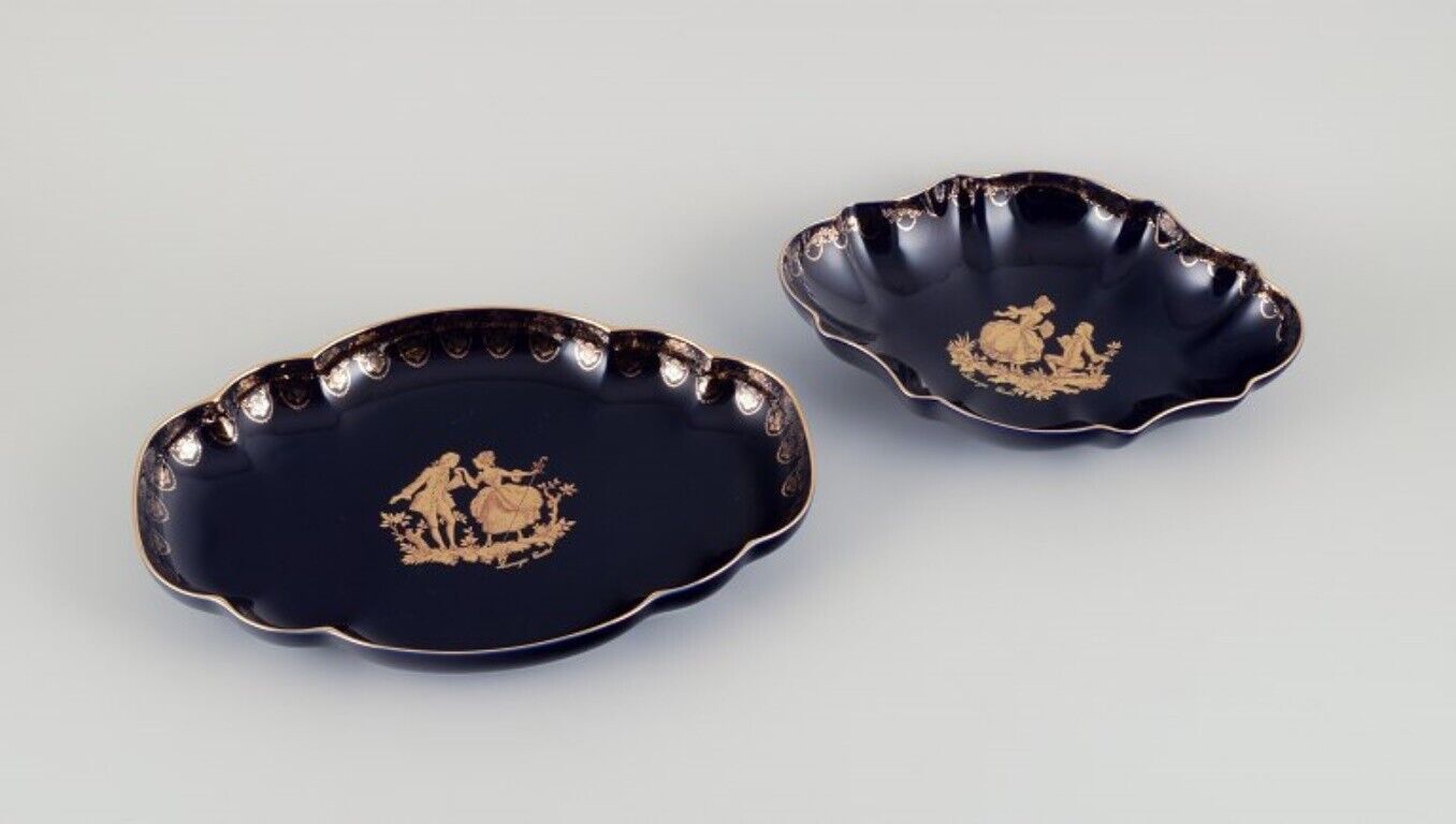 Limoges France Two porcelain serving platters adorned with 22-karat gold leaf