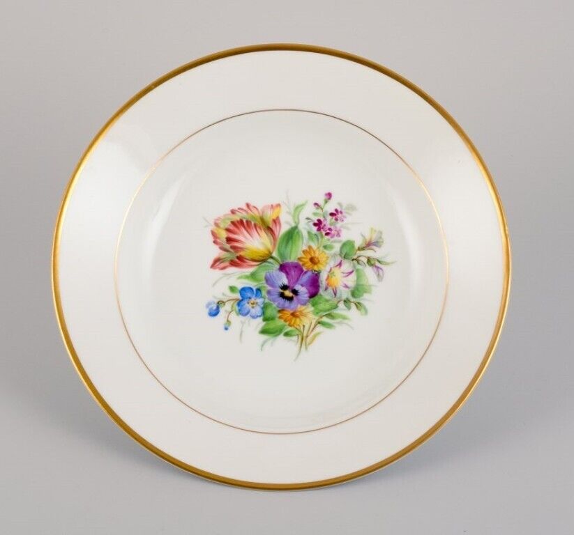 Bing  Grøndahl eight deep plates in porcelain with flowers and gold decoration