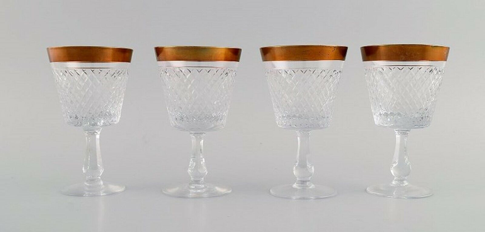 Four wine glasses in mouth-blown crystal glass with gold edge France 1930s