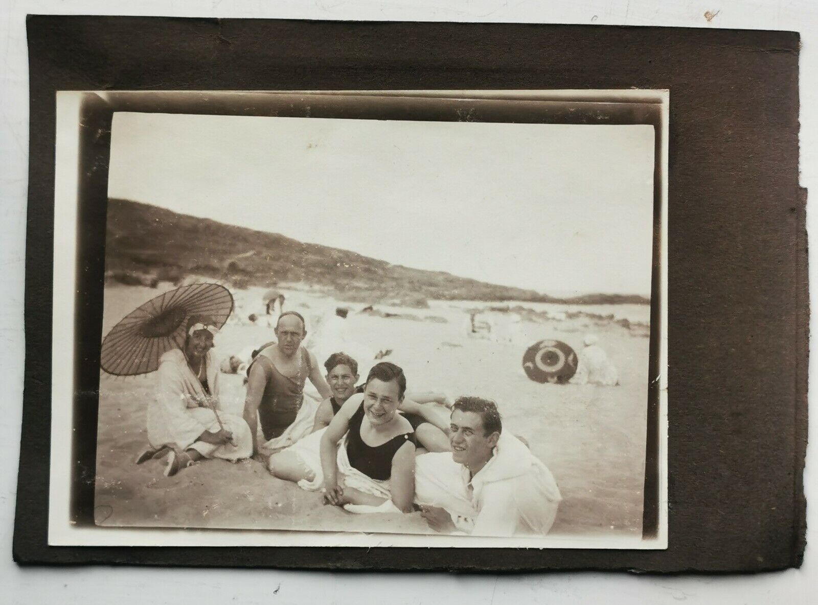 Old photo: Four young men friends buddies with young woman on the beach  Fo592