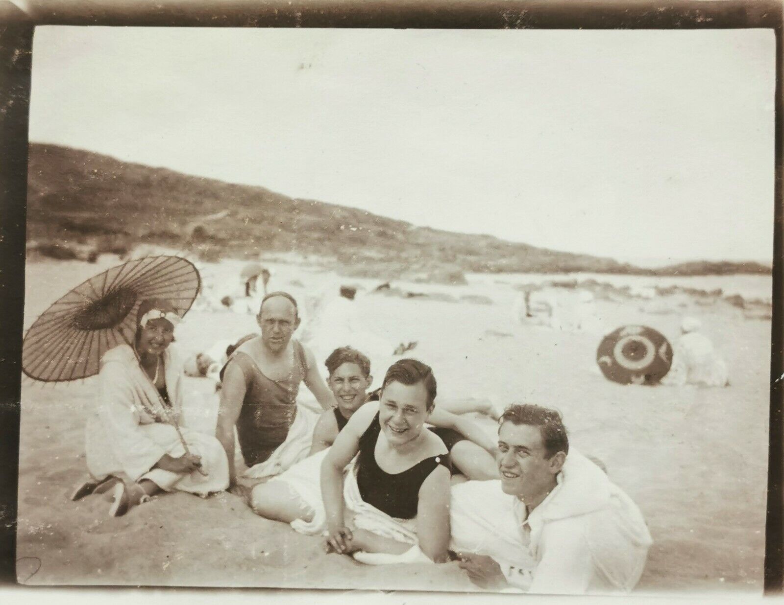 Old photo: Four young men friends buddies with young woman on the beach  Fo592