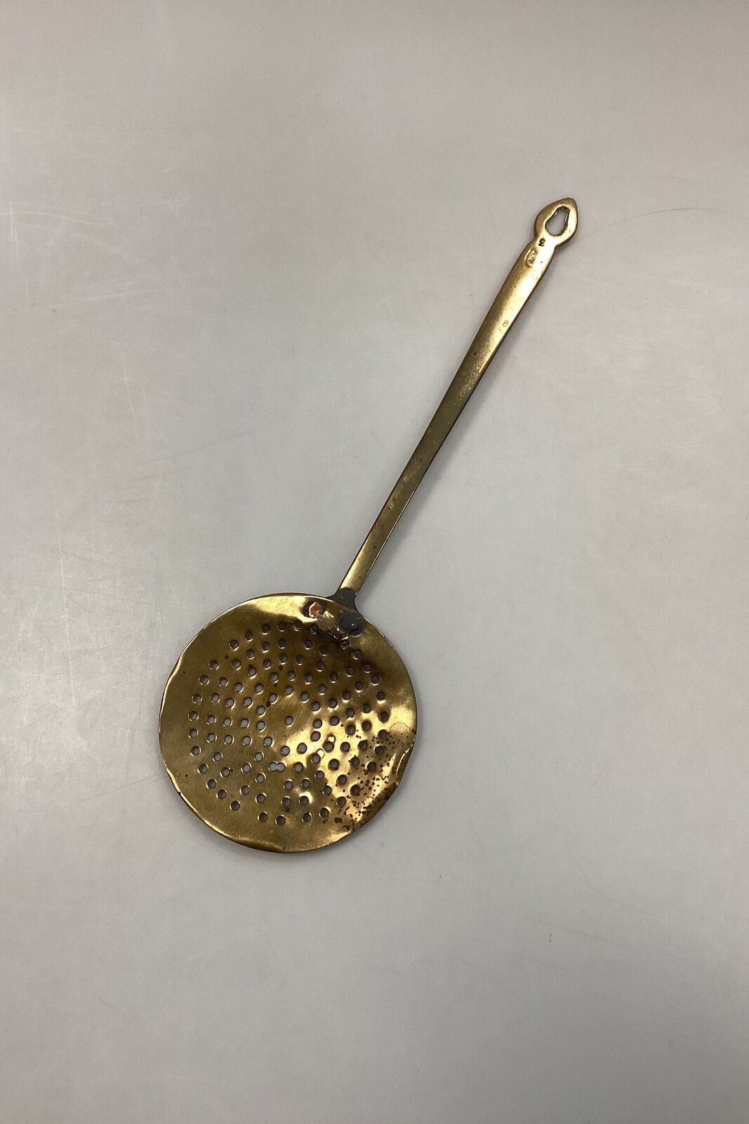 Antique hollow spoon in brass