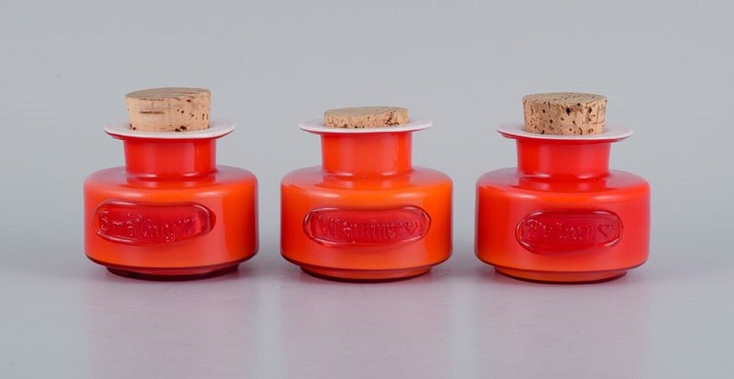 Michael Bang for Holmegaard Three spice jars in orange and white art glass