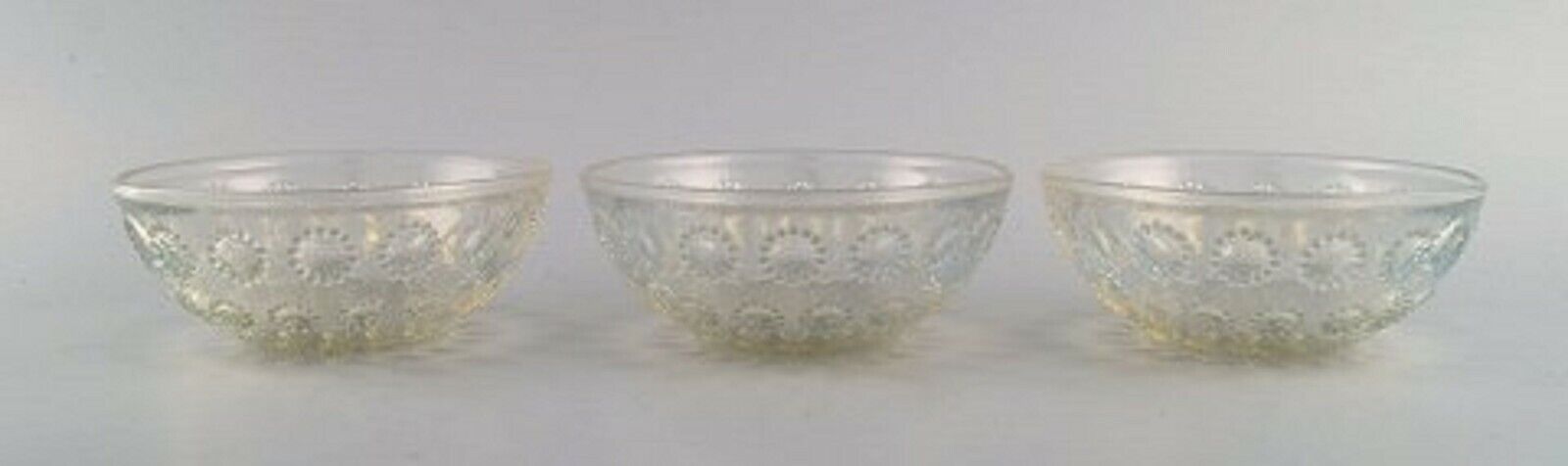 Three early René Lalique "Asters" bowls in art glass Dated before 1945