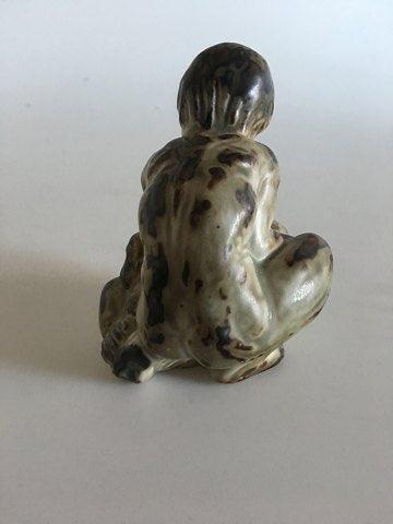 Royal Copenhagen Stoneware Figurine of a child with a bear No 20245