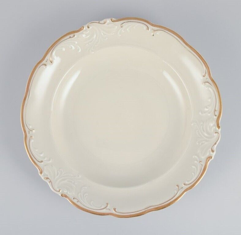 KPM Poland Four large deep porcelain plates in cream color with gold rim