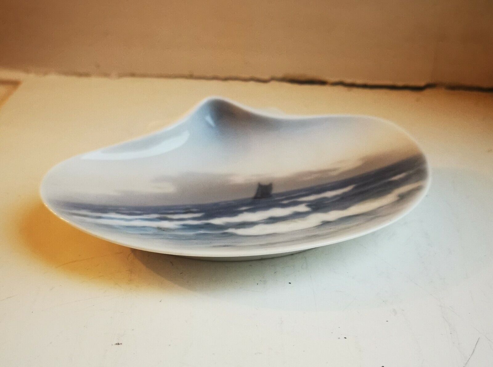 Old Royal Copenhagen porcelain dish in organic shape with boad sea motif 1930s