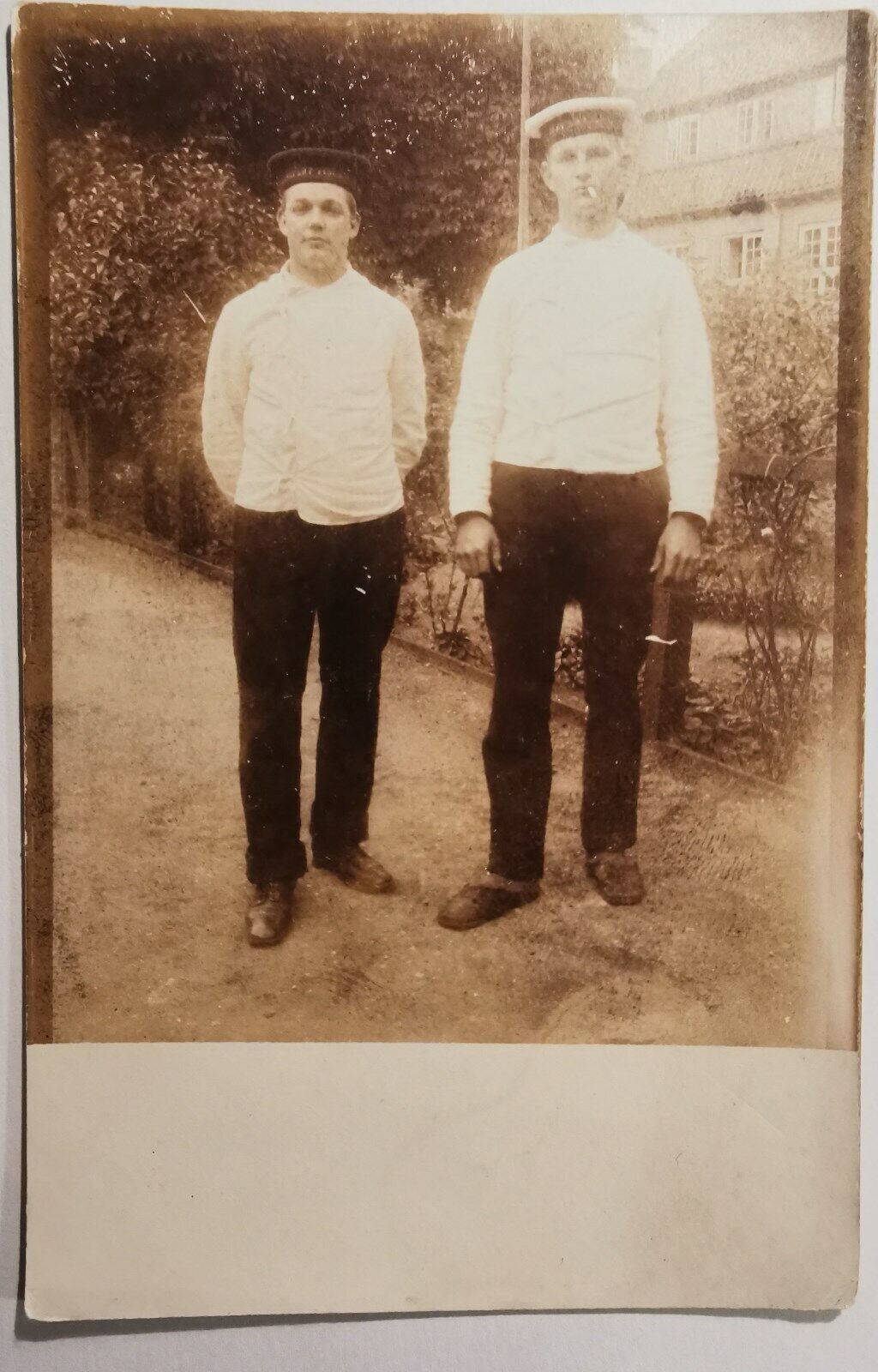 Vintage postcard: Two young sailors one with a cigarette in his mouth  pok1179