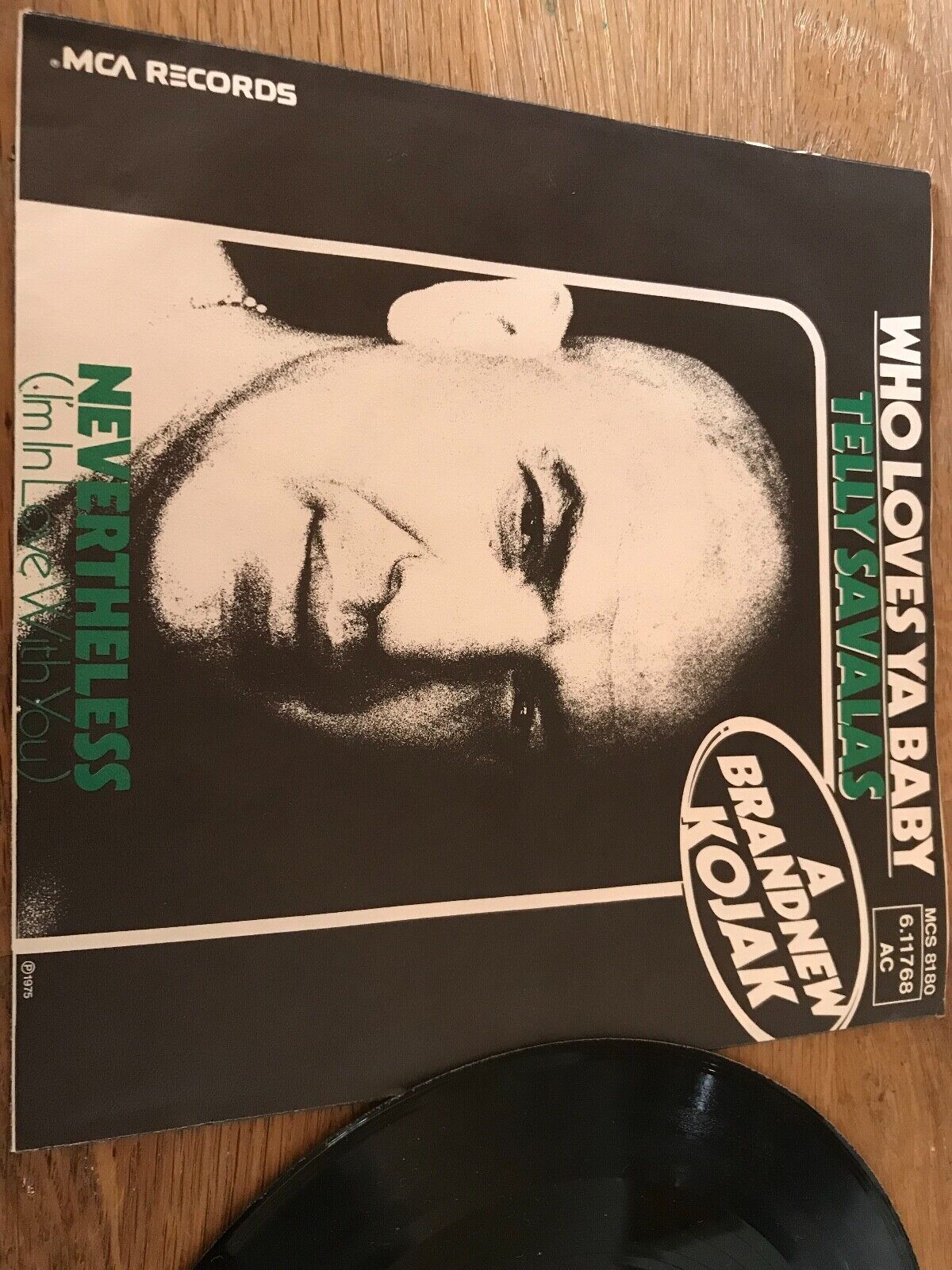 TELLY SAVALAS "WHO LOVES YA BABY/NEVERTHELESS" MCA RECORDS WEST GERMAN 7" 1975**