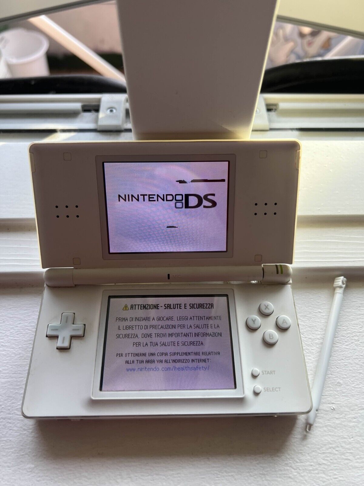 Nintendo DS Lite Handheld Console - White with stylus charger and 4 games