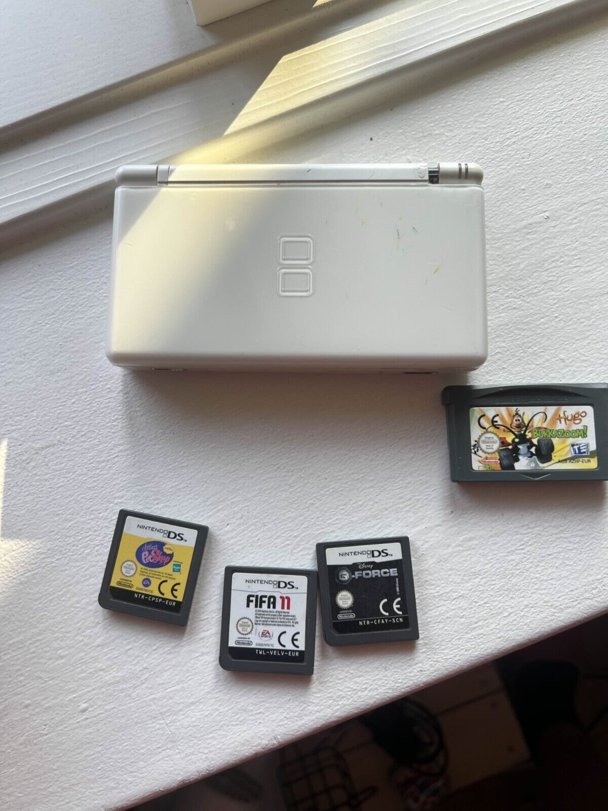 Nintendo DS Lite Handheld Console - White with stylus charger and 4 games