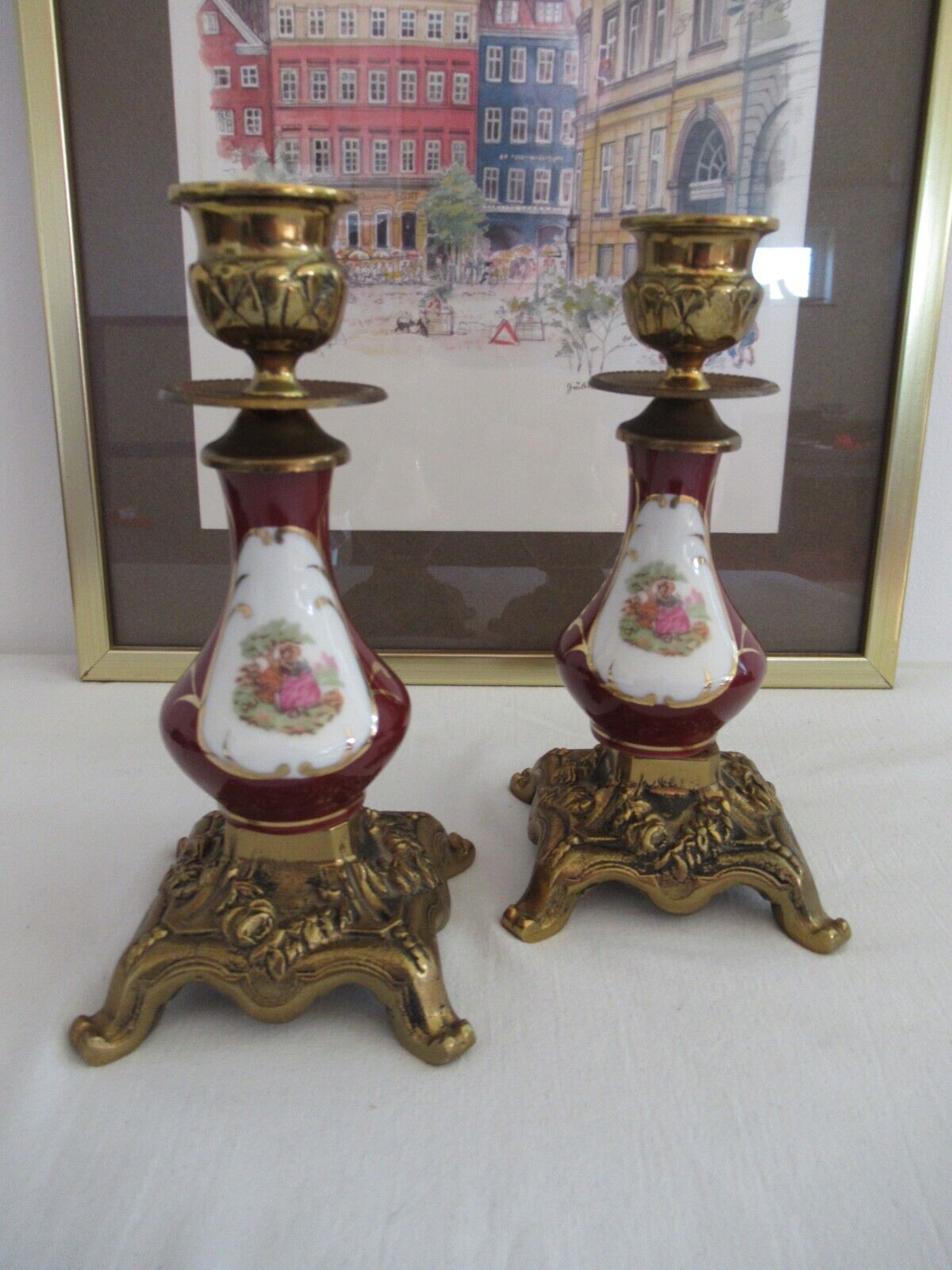 Vintage pair of candle holders in brass and porcelain with a romantic scene