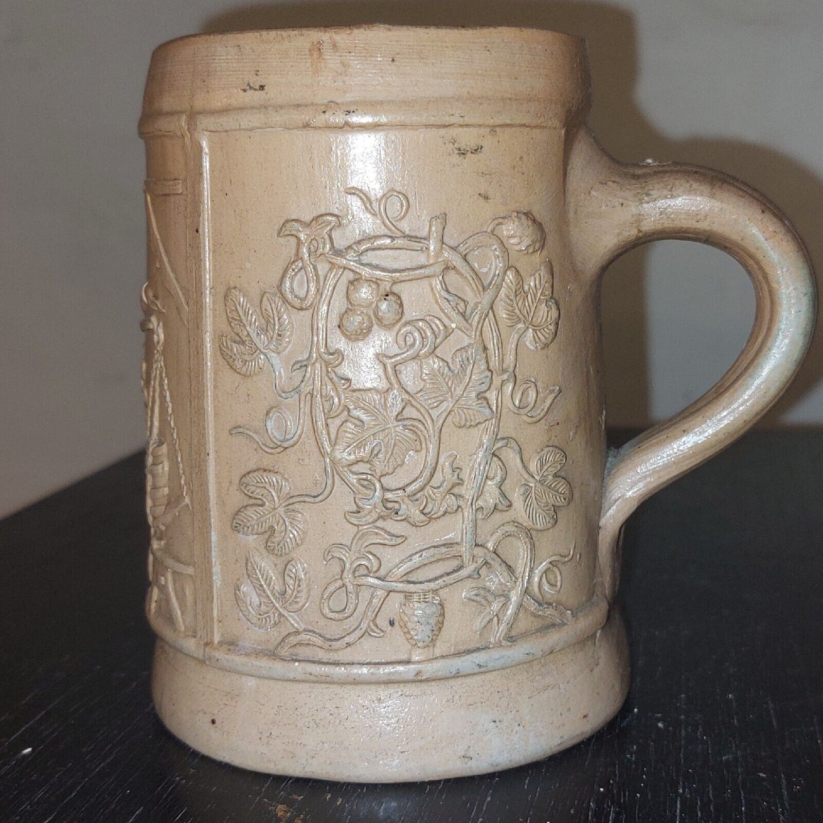 Antique stoneware mug from Germany c 1860 with relief decoration