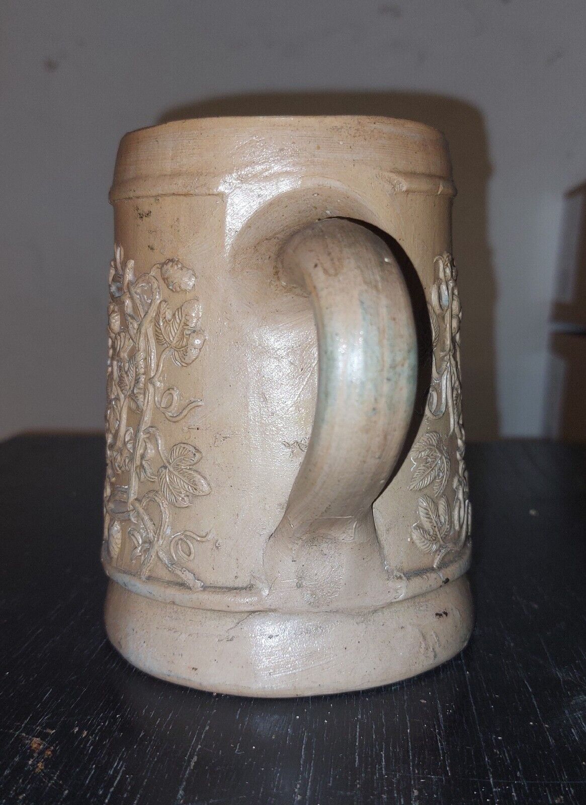 Antique stoneware mug from Germany c 1860 with relief decoration