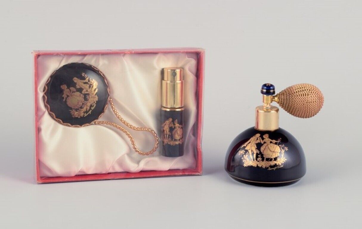 Limoges France Two porcelain perfume atomizers and a makeup mirror