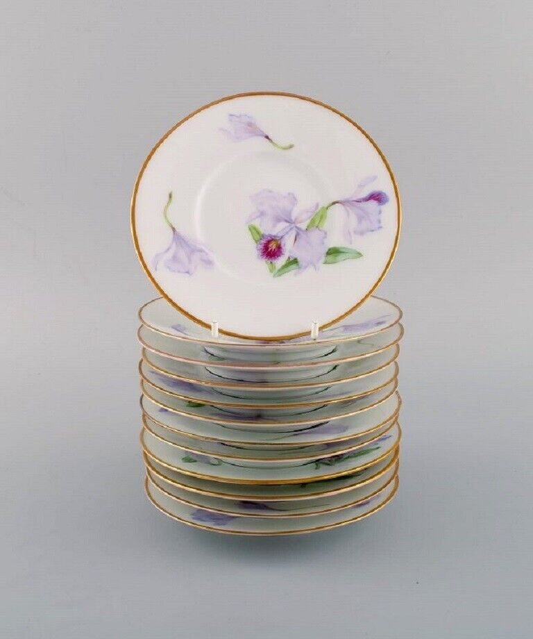 Twelve antique unique Royal Copenhagen porcelain plates with iris flowers