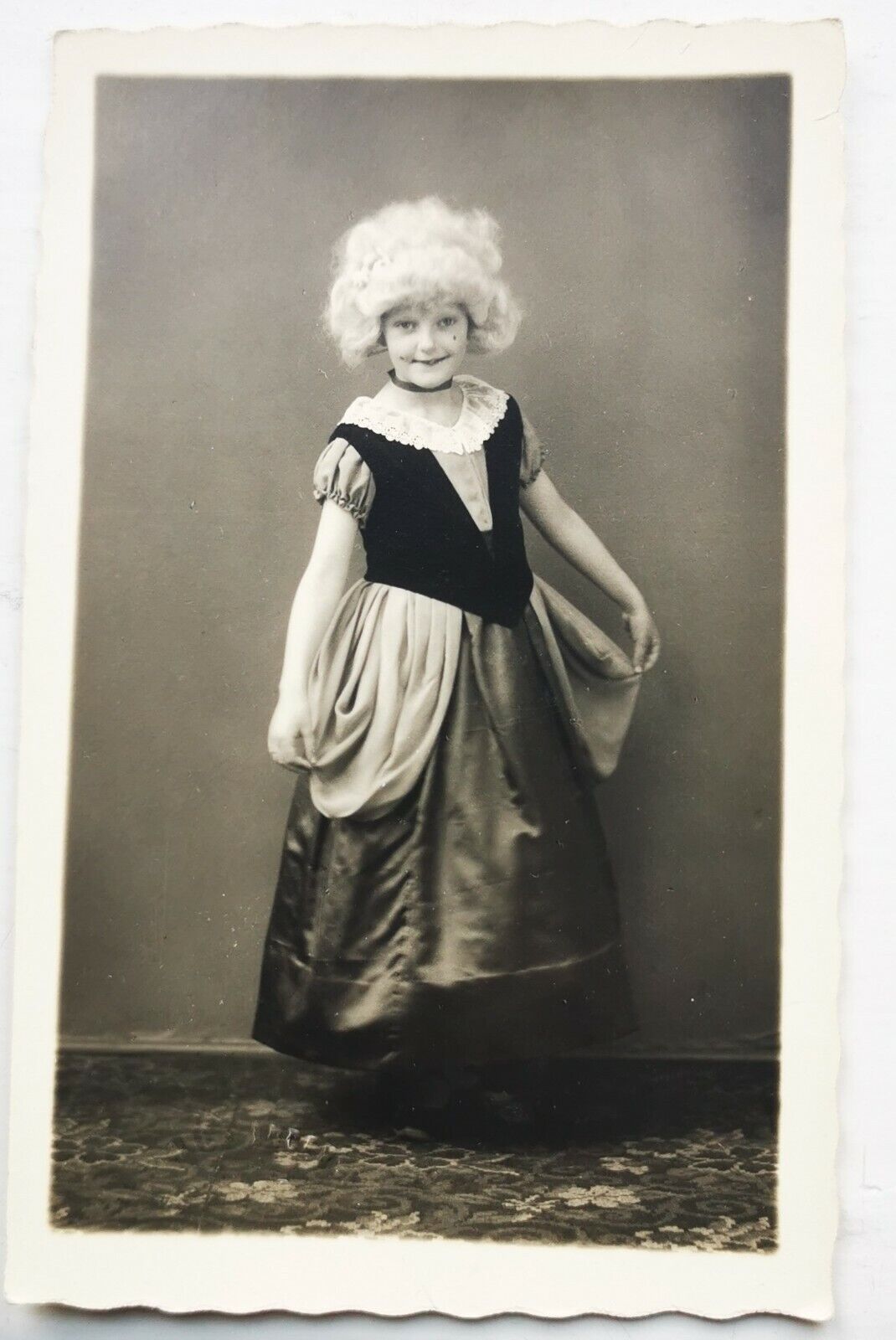 Photo postcard:  Young smiling girl standing in roccoco wig and dress  pok1196