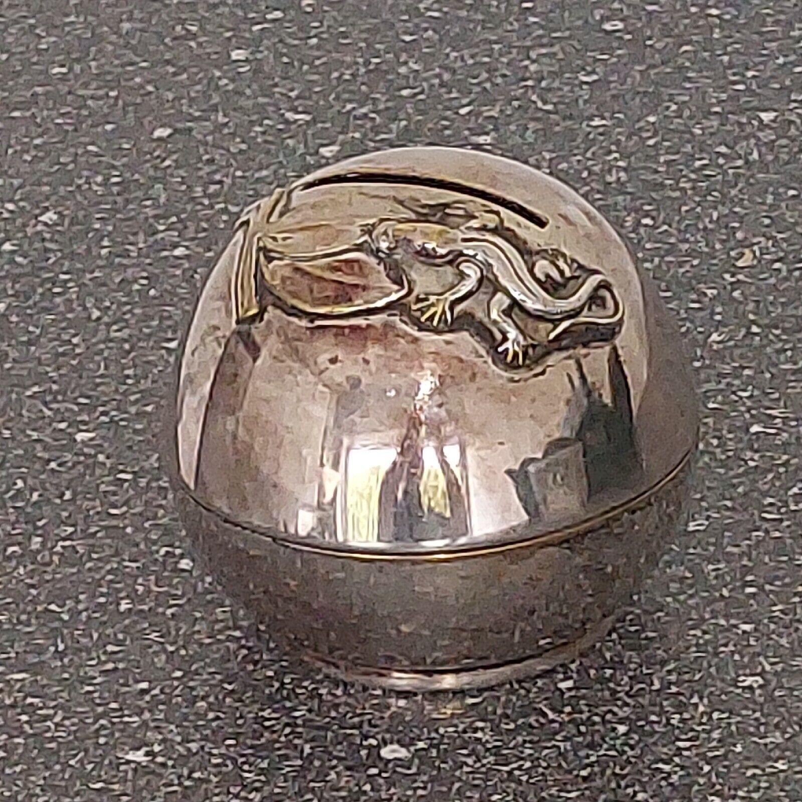 Small round silver plated  money bank with lizzard on top c 1930