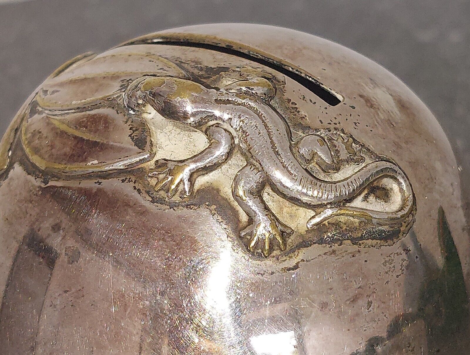 Small round silver plated  money bank with lizzard on top c 1930