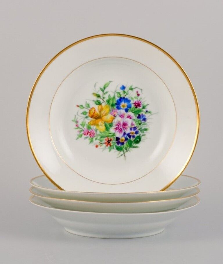 Bing  Grøndahl four deep plates in porcelain with flowers and gold decoration