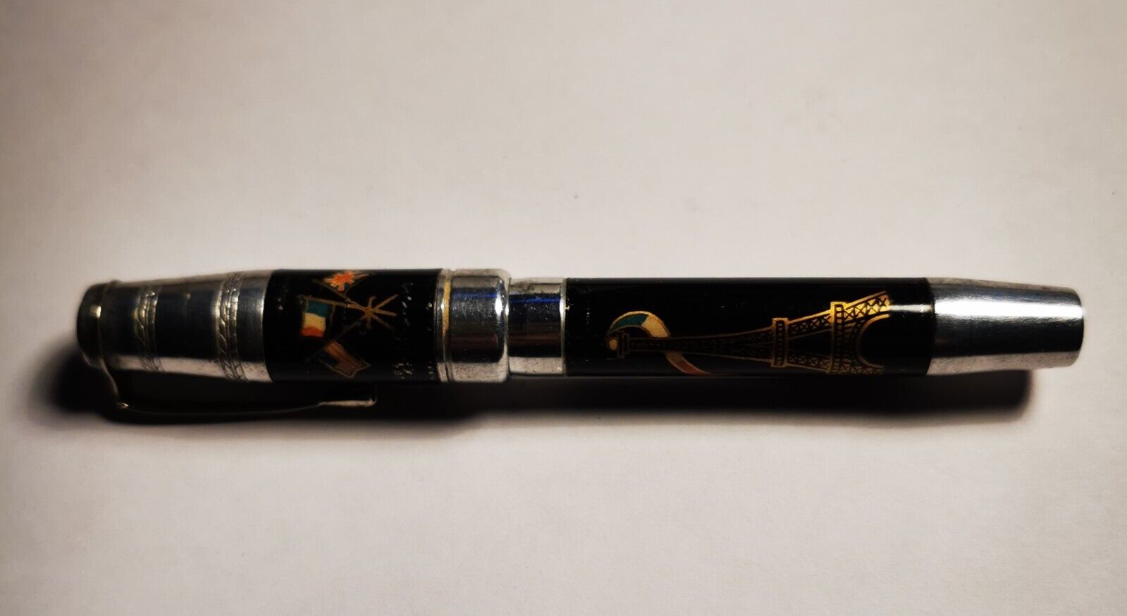 Parisian souvenir metal fountain pen with enameled Eiffel Tower and flags