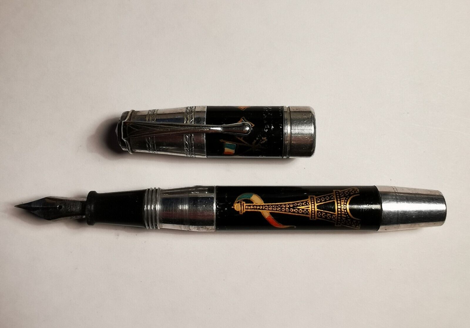 Parisian souvenir metal fountain pen with enameled Eiffel Tower and flags